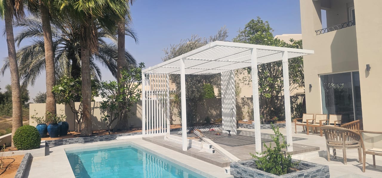 White poolside pergola — Arabian Ranches pool deck